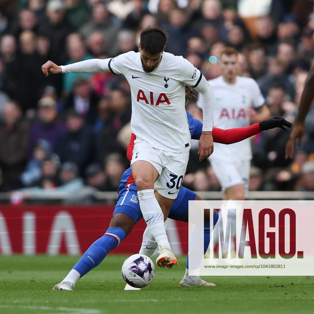 Rodrigo Bentancur of Tottenham Hotspur is challenged by Eberechi Eze of Crystal Palace during the Premier League match between Tottenham Hotspur and Crystal Palace at Tottenham Hotspur Stadium, London, England on 2 March 2024.