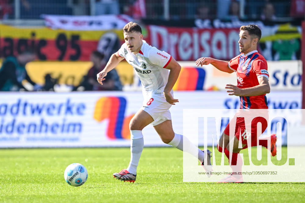Maximilian Eggestein (SC Freiburg) und Marvin Pieringer (1.FC Heidenheim) im Zweikampf waehrend des Spiels der 1. Bundesliga zwischen dem 1. FC Heidenheim 1846 und SC Freiburg, Voith-Arena am 21. September 2024 in Heidenheim, Deutschland. (Foto von Harry Langer DeFodi Images) +++ Maximilian Eggestein (SC Freiburg) und Marvin Pieringer (1.FC Heidenheim) battle for the ball during the Bundesliga match between 1. FC Heidenheim 1846 and SC Freiburg at Voith Arena on September 21, 2024 in Heidenheim, Germany. (Photo by Harry Langer DeFodi Images) DFL regulations prohibit any use of photographs as image sequences and or quasi-video. Defodi-541_FCHSCF20240920_148