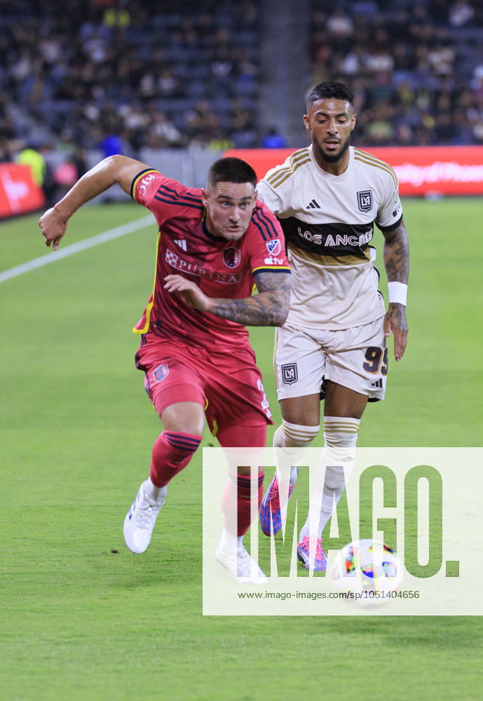 Denis Bouanga 99 of the Los Angeles Football Club and Jake Nerwinski 2 of the St. Louis City SC struggle for possession of the ball during their regular season MLS, Fussball Herren, USA game on Wednesday October 2, 2024 at the BMO Stadium in Los Angeles, California. LAFC defeats St. Louis, 1-0. ARIANA RUIZ PI Los Angeles U.S - ZUMAp124 20241002_zaa_p124_100