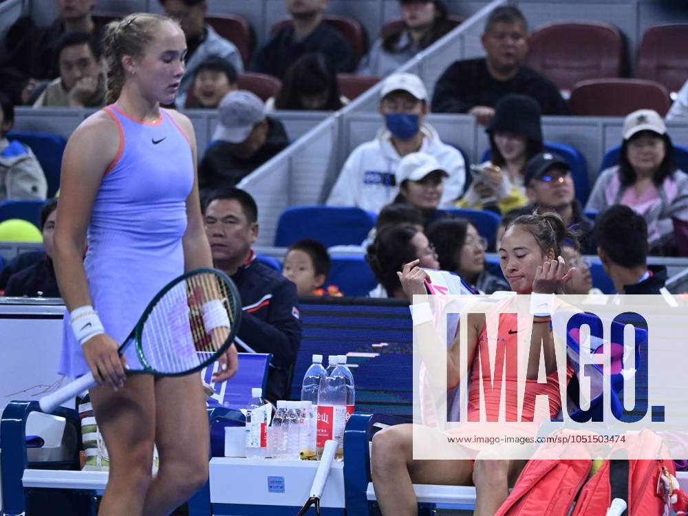 (241004) -- BEIJING, Oct. 4, 2024 -- Zheng Qinwen (R) and Mirra Andreeva react during the women s singles quarterfinal match between Zheng Qinwen of China and Mirra Andreeva of Russia at the 2024 China Open tennis tournament in Beijing, China, Oct. 4, 2024. ) (SP)CHINA-BEIJING-TENNIS-CHINA OPEN-WOMEN S SINGLES(CN) ZhangxLong