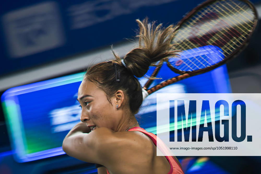 (241010) -- BEIJING, Oct. 10, 2024 -- Zheng Qinwen hits a return during the round of 32 match between Zheng Qinwen of China and Jaqueline Cristian of Romania at the 2024 Wuhan Open tennis tournament in Wuhan, capital of central China s Hubei Province, Oct. 9, 2024. ) XINHUA PHOTOS OF THE DAY XiaoxYijiu