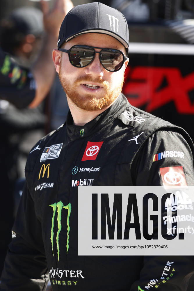 CHARLOTTE, NC - OCTOBER 12: Tyler Reddick ( 45 23XI Racing Monster Energy Toyota) talks with members of his crew during practice for the NASCAR, Motorsport, USA Cup Series Bank of America ROVAL 400 on October 12, 2024 at Charlotte Motor Speedway in Charlotte, NC. (Photo by Jeff Robinson Icon Sportswire) AUTO: OCT 12 NASCAR Cup Series Bank of America ROVAL 400 Icon2410122399400