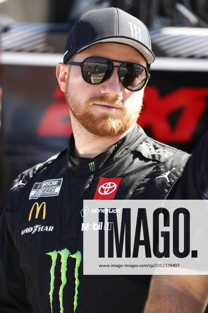CHARLOTTE, NC - OCTOBER 12: Tyler Reddick ( 45 23XI Racing Monster Energy Toyota) talks with members of his crew during practice for the NASCAR, Motorsport, USA Cup Series Bank of America ROVAL 400 on October 12, 2024 at Charlotte Motor Speedway in Charlotte, NC. (Photo by Jeff Robinson Icon Sportswire) AUTO: OCT 12 NASCAR Cup Series Bank of America ROVAL 400 Icon2410122402400