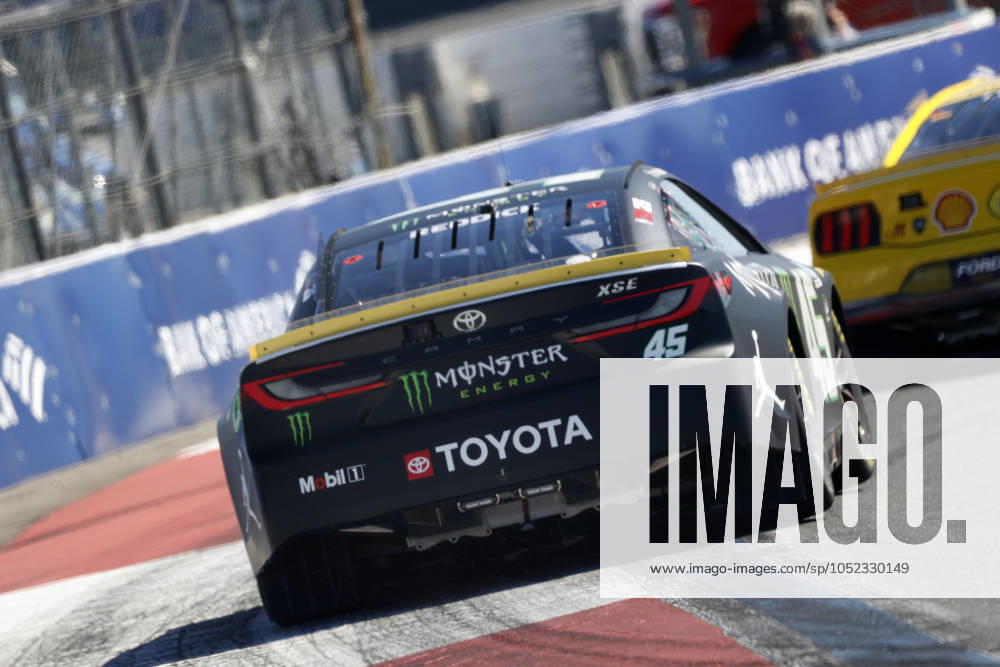 CHARLOTTE, NC - OCTOBER 12: Tyler Reddick ( 45 23XI Racing Monster Energy Toyota) exits turn 3 during qualifying for the NASCAR, Motorsport, USA Cup Series Bank of America ROVAL 400 on October 12, 2024 at Charlotte Motor Speedway in Charlotte, NC. (Photo by Jeff Robinson Icon Sportswire) AUTO: OCT 12 NASCAR Cup Series Bank of America ROVAL 400 Icon2410122901400
