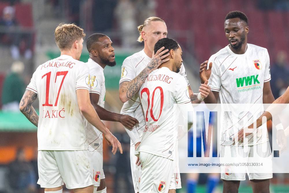 Torjubel, jubelt nach seinem Treffer zum 1:0 von Alexis Claude-Maurice (FC Augsburg), Kristijan Jakić (FC Augsburg), Frank Onyeka (FC Augsburg), Marius Wolf (FC Augsburg) und Chrislain Matsima (FC Augsburg) v-l FC Augsburg vs. FC FC Schalke 04, Fussball, DFB-Pokal, 2. Runde, 29.10.2024 DFB regulations prohibit any use of photographs as image sequences and or quasi-video Augsburg Bayern Deutschland