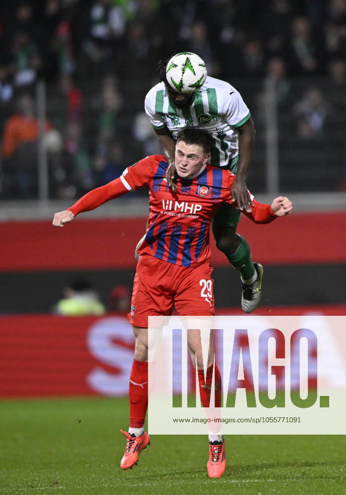 Kopfballduell Zweikampf Aktion Mikkel Kaufmann 1. FC Heidenheim 1846 FCH (29) gegen Stephan Ambrosius FC St. Gallen (05) 1. FC Heidenheim 1846 FCH vs FC St. Gallen 1879 19.12.2024 UEFA Conference League DFL REGULATIONS PROHIBIT ANY USE OF PHOTOGRAPHS AS IMAGE SEQUENCES AND OR QUASI-VIDEO 1. FC Heidenheim 1846 FCH vs FC St. Gallen 1879