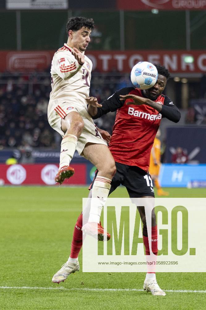 Aleksandar Pavlovic (FC Bayern München, 45), Edmond Tapsoba (Bayer 04 Leverkusen, 12). Leverkusen, Fussball 1.Bundesliga 22. Spieltag, Spieltag 22, Bayer 04 Leverkusen - FC Bayern München, 15.02.2024, BayArena, Leverkusen. DFL regulations prohibit any use of photographs as image sequences and or quasi-video Â