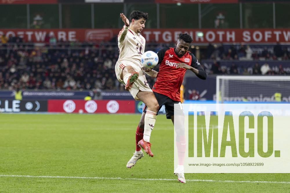 Aleksandar Pavlovic (FC Bayern München, 45), Edmond Tapsoba (Bayer 04 Leverkusen, 12). Leverkusen, Fussball 1.Bundesliga 22. Spieltag, Spieltag 22, Bayer 04 Leverkusen - FC Bayern München, 15.02.2024, BayArena, Leverkusen. DFL regulations prohibit any use of photographs as image sequences and or quasi-video Â