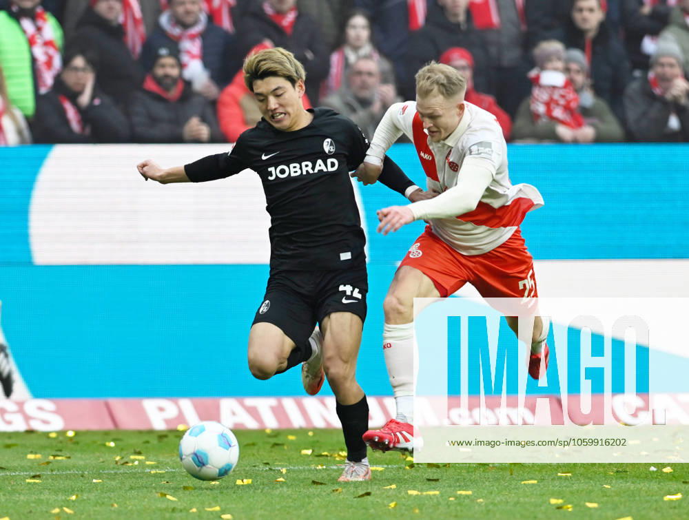 Fussball-Bundesliga - Saison 2024 2025 Mewa-Arena Mainz - 15.03.2025 1. FSV Mainz 05 (mz) - FC Freiburg (fr) 2:2 Ritsu DOAN (SC Freiburg), li - Andreas HANCHE-OLSEN (1. FSV Mainz 05) DFL REGULATIONS PROHIBIT ANY USE OF PHOTOGRAPHS AS IMAGE SEQUENCES AND OR QUASI VIDEO NATIONAL AND INTERNATIONAL NEWS AGENCIES OUT Fussball-Bundesliga - 1. FSV Mainz 05