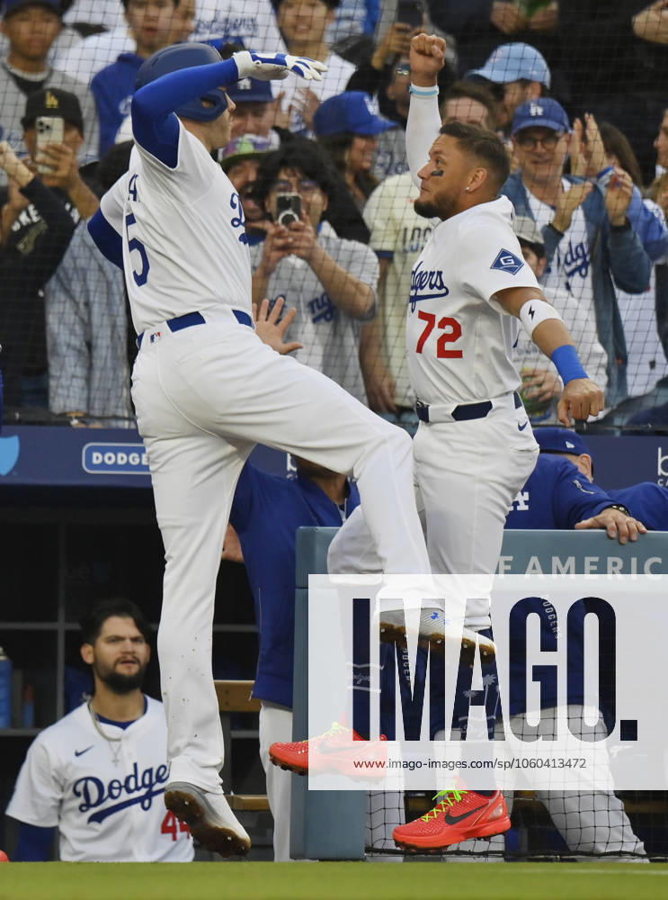 Los Angeles Dodgers first baseman Freddie Freeman(L) celebrates with Miguel Vargas after hitting a solo home run in the first inning off Detroit Tigers starting pitcher Reese Olson at Dodger Stadium in Los Angeles on Saturday, March 29, 2025. The Dodgers defeated the Detroit Tigers 7-3. LAP2025032906 JIMxRUYMEN
