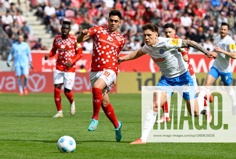 Fussball-Bundesliga - Saison 2024 2025 Mewa-Arena Mainz - 05.04.2025 1. FSV Mainz 05 (mz) - Holstein Kiel (ki) Nadiem AMIRI (1. FSV Mainz 05), li - Nicolai REMBERG (Holstein Kiel) DFL REGULATIONS PROHIBIT ANY USE OF PHOTOGRAPHS AS IMAGE SEQUENCES AND OR QUASI VIDEO NATIONAL AND INTERNATIONAL NEWS AGENCIES OUT Fussball-Bundesliga - 1. FSV Mainz 05