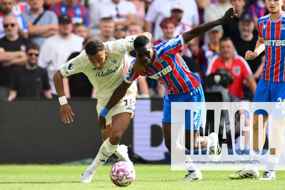 Crystal Palace v Nottingham Forest - Premier League Dan Ndoye of Nottingham Forest battles with Ismaila Sarr of Crystal Palace during the Premier League match between Crystal Palace and Nottingham Forest at Selhurst Park in London, England, on August 24, 2025. London Greater London United Kingdom