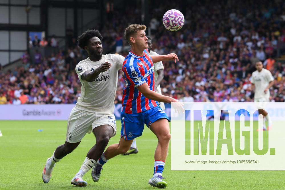 Crystal Palace v Nottingham Forest - Premier League Justin Devenny of Crystal Palace is under pressure from Ola Aina of Nottingham Forest during the Premier League match between Crystal Palace and Nottingham Forest at Selhurst Park in London, England, on August 24, 2025. London Greater London United Kingdom