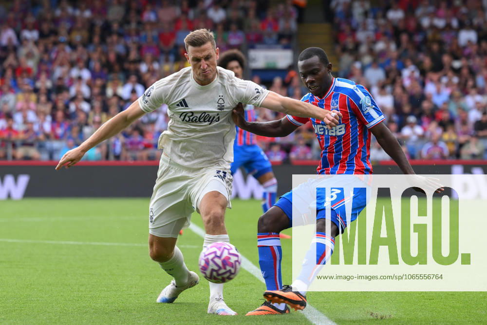 Crystal Palace v Nottingham Forest - Premier League Neco Williams of Nottingham Forest puts pressure on Tyrick Mitchell of Crystal Palace during the Premier League match between Crystal Palace and Nottingham Forest at Selhurst Park in London, England, on August 24, 2025. London Greater London United Kingdom
