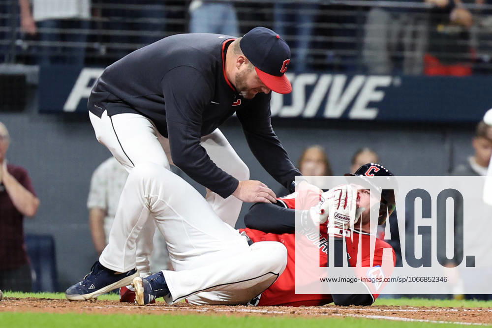 Cleveland Guardians manager Stephen Vogt comes to the aid of David Fry (6) after he fouled a pitch off his bat into his face in the sixth inning against the Detroit Tigers at Progressive Field in Cleveland, Ohio on Tuesday, September 23, 2025. Fry would leave the game. CLE20250923118 AARONxJOSEFCZYK