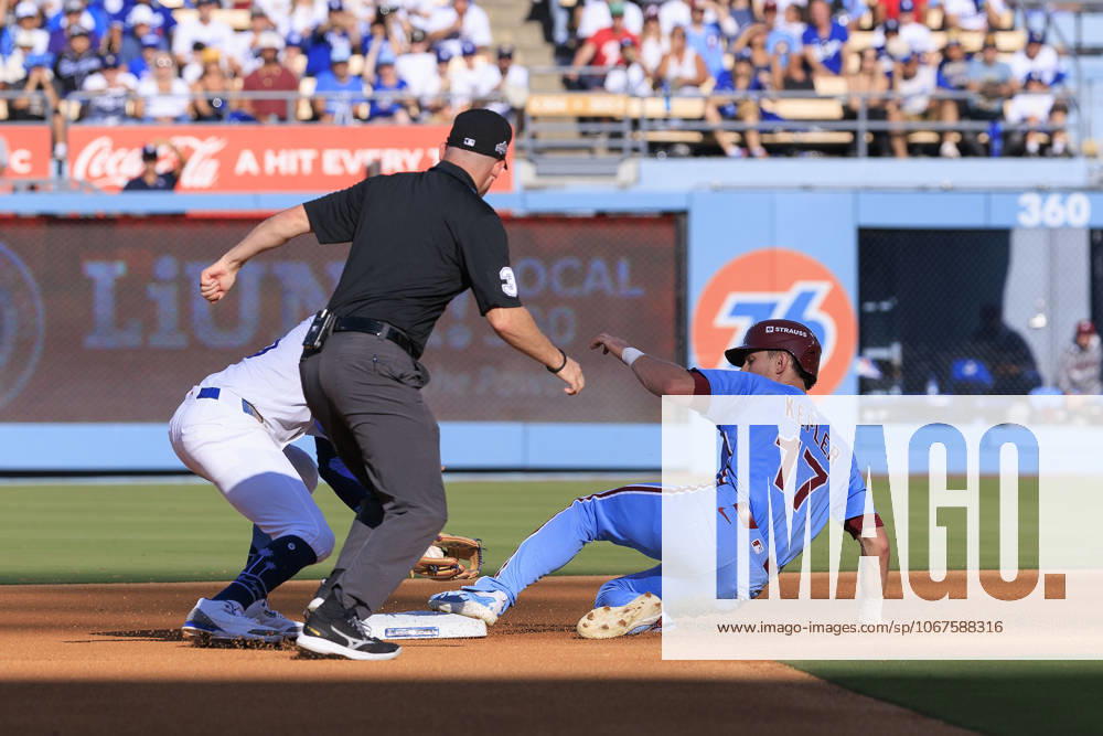 Max Kepler 17 of the Philadelphia Phillies slides safely into second base on a late tag by Mookie Betts 50 of the Los Angeles Dodgers during their MLB, Baseball Herren, USA National League Division Series Game 4 on Thursday October 9, 2025 at Dodger Stadium in Los Angeles, California. Dodgers defeat Phillies, 2-1 in ten innings to win the NLDS. JAVIER ROJAS PI Los Angeles USA - ZUMAp124 20251009_zaa_p124_050