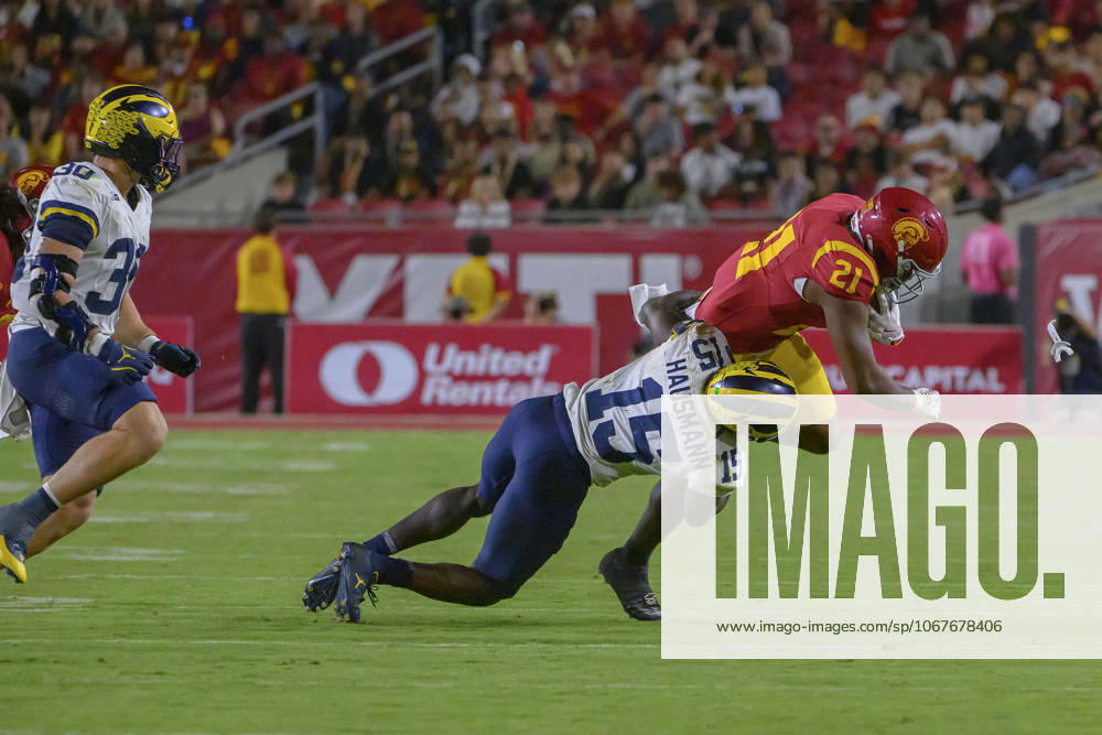 21 Bryan Jackson, RB of the USC Trojans is tackled by 15 Ernest Hausmann, LB of the Michigan Wolverines during their BIG 10 football game on Saturday October 11, 2025 at the Los Angeles Coliseum in Los Angeles, California. Trojans defeat Wolverines, 31-13. MARK HAMMOND BNS PI Los Angeles USA - ZUMAp124 20251011_zaa_p124_116