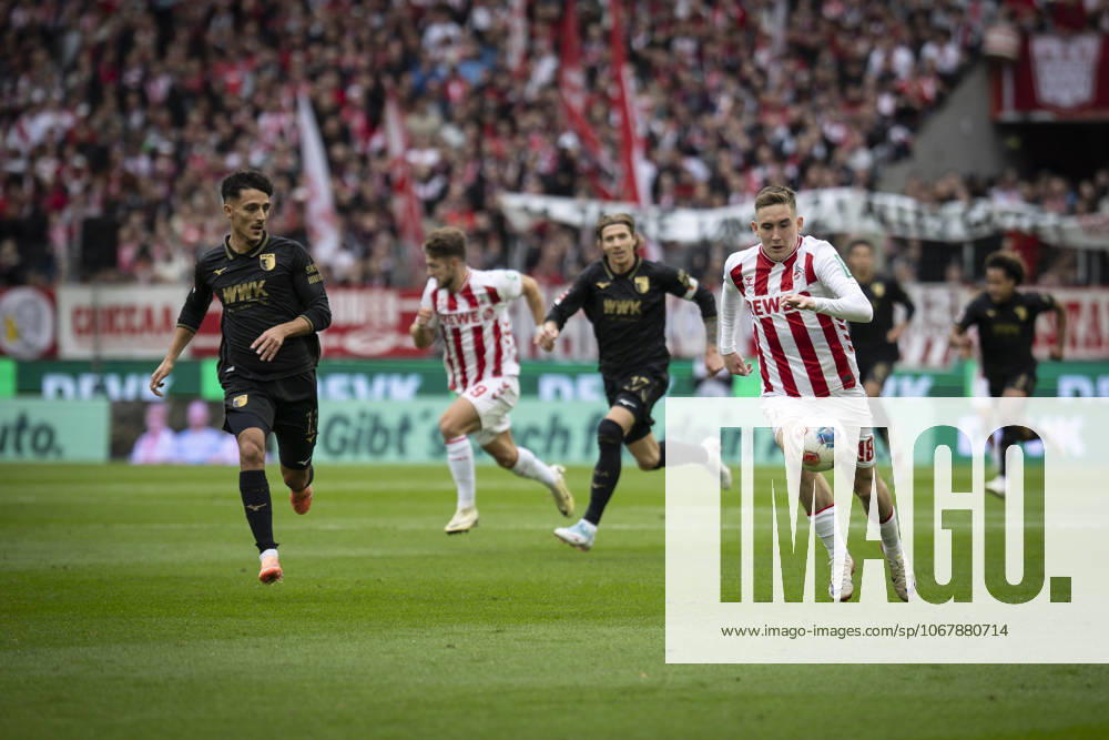 Isak Johannesson (1. FC Koeln, 18), Dimitris Giannoulis (FC Augsburg, 13) competing during the Bundesliga match between 1. FC Koeln vs. FC Augsburg at the Rheinenergie-Stadion on matchday 7 of the 1. Bundesliga on October 18, 2025 in Koeln, Germany. DFL REGULATIONS PROHIBIT ANY USE OF PHOTOGRAPHS AS IMAGE SEQUENCES AND OR QUASI-VIDEO. Nordrhein-Westfalen Germany