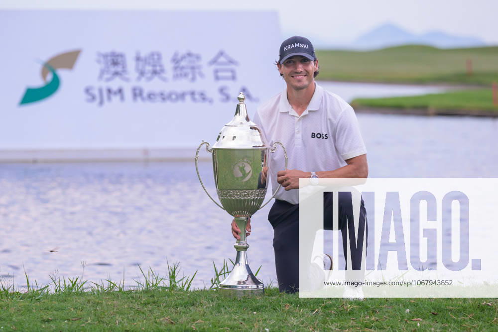 Macau Open Golf , Final Round, Macau Golf and Country Club Coloane, Macao, China . GermanyÃ¢â‚¬â ¢s Dominic Foos Wins the Macau Open Golf after a tiebreaker with Taiwans Wang, Wei-hsuan. Foos holds the cup by the lake on the 18th fairway. Macao China - ZUMAr144 20251019_zap_r144_008