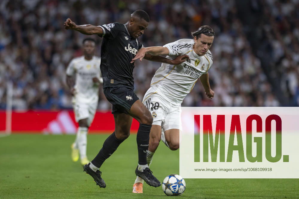 ALVARO CARRERAS of Real Madrid CF and PIERRE KALULU of Juventus de Turin in action during the match on the third day of the group stage of the 2025 26 UEFA Champions League between REAL MADRID C.F. vs JUVENTUS DE TURIN, played at the Santiago Bernabeu Stadium on October 22, 2025, in Madrid, Spain. Madrid Spain - ZUMAc312 20251023_zsp_c312_042