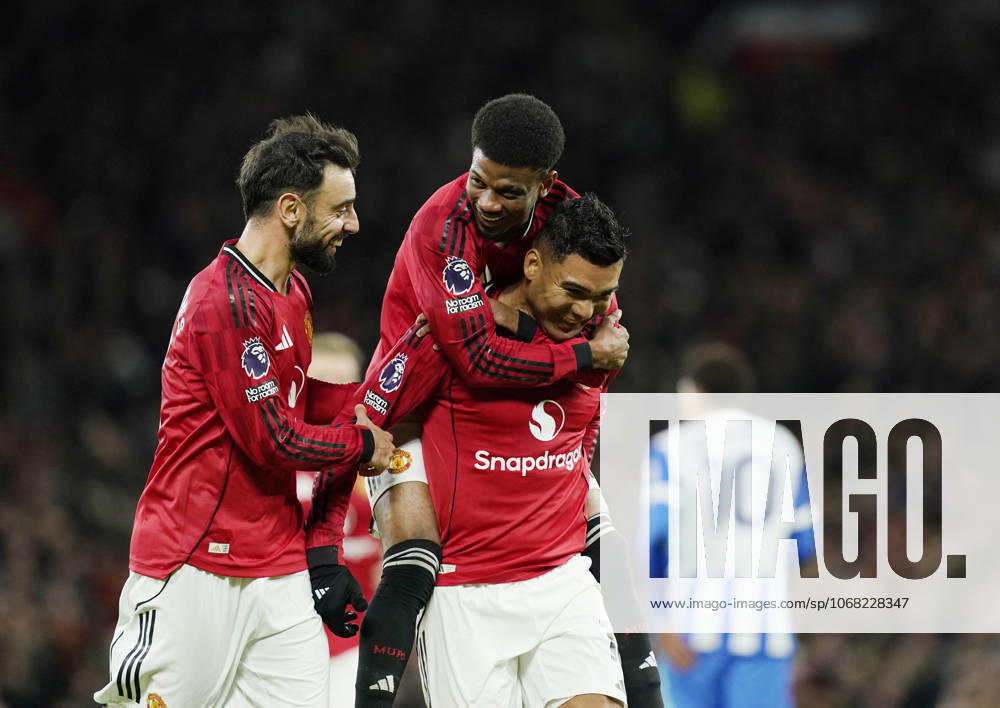 Manchester, England, 25th October 2025. Amad Diallo of Manchester United, ManU jumps up onto Casemiro of Manchester United as they celebrate after his shot was deflected into the goal by Yasin Ayari of Brighton during the Manchester United vs Brighton and Hove Albion Premier League match at Old Trafford, Manchester. Picture credit should read: Andrew Yates Sportimage . SPI_037_AY_Man_Utd_Brighton SPI-4237-0036