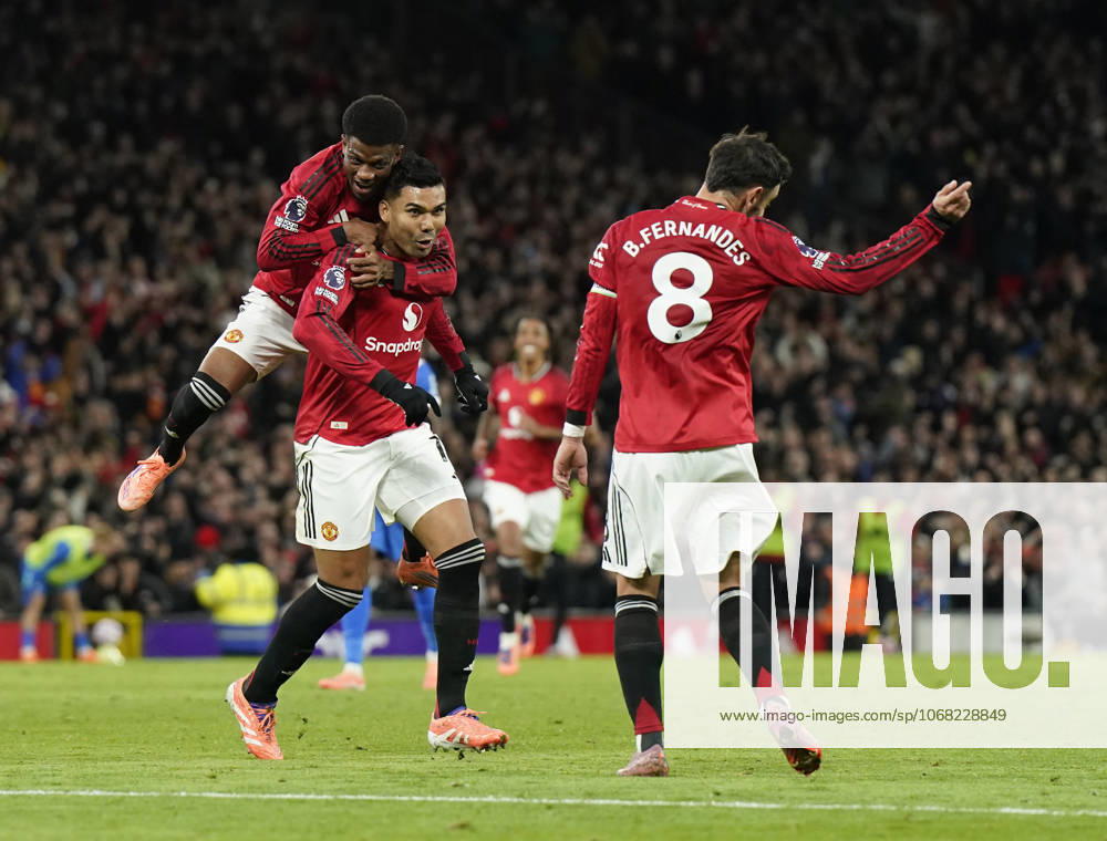 Manchester, England, 25th October 2025. Amad Diallo of Manchester United, ManU jumps up onto Casemiro of Manchester United as he celebrates after his shot was deflected into the goal by Yasin Ayari of Brighton for their second goal during the Manchester United vs Brighton and Hove Albion Premier League match at Old Trafford, Manchester. Picture credit should read: Andrew Yates Sportimage . SPI_042_AY_Man_Utd_Brighton SPI-4237-0044