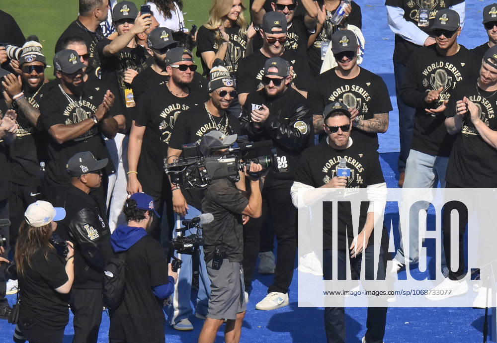 Los Angeles Dodgers first baseman Freddie Freeman (R) celebrates their World Series win with teammates following a parade at Dodger Stadium in Los Angeles on Monday, November 3, 2025. LAP2025110313 JIMxRUYMEN