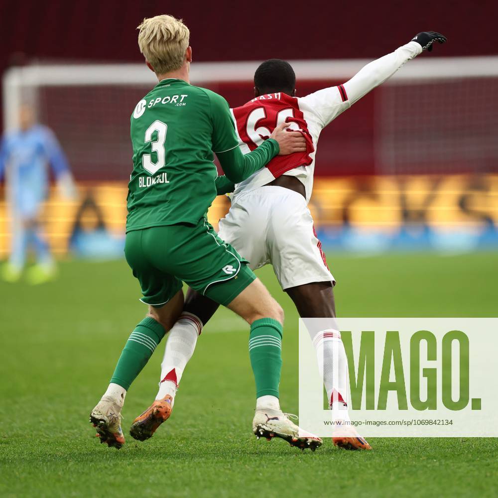 , JohanCruyff Arena , season 2025 2026 , Dutch Eredivisie Football , match between Ajax and FC Groningen (replay) , Picture shows , FC Groningen player Thijmen Blokzijl, Ajax player Pharell Nash Ajax - Groningen (replay) x32313313x