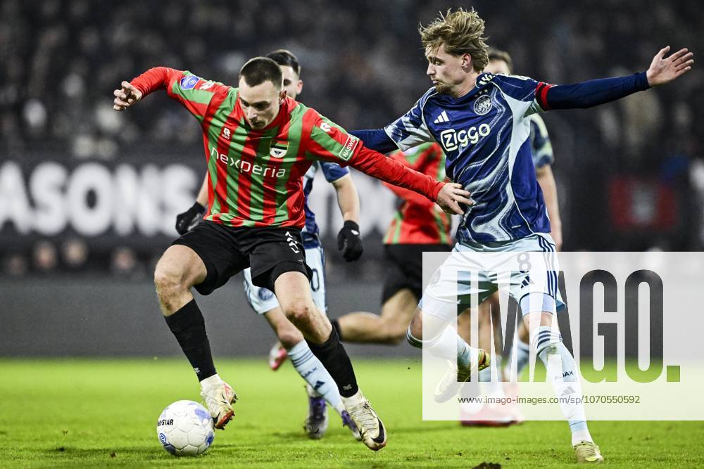 NIJMEGEN - (l-r) Darko Nejasmic of NEC Nijmegen and Kenneth Taylor of Ajax during the Dutch Eredivisie match between NEC Nijmegen and AFC Ajax at De Goffert on December 20, 2025, in Nijmegen, Netherlands. ANP OLAF KRAAK Eredivisie 2025-2026 ANPxSportx IVx 545419438 originalFilename: 545419438