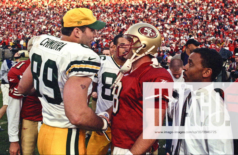 San Francisco, California, U.S - San Francisco 49ers vs. Green Bay Packers Candlestick Park Sunday, January 3, 1999. 49ers beat Packers 30-27. Green Bay Packers tight end Mark Chmura (89) and San Francisco 49ers quarterback Steve Young (8) talk after game.