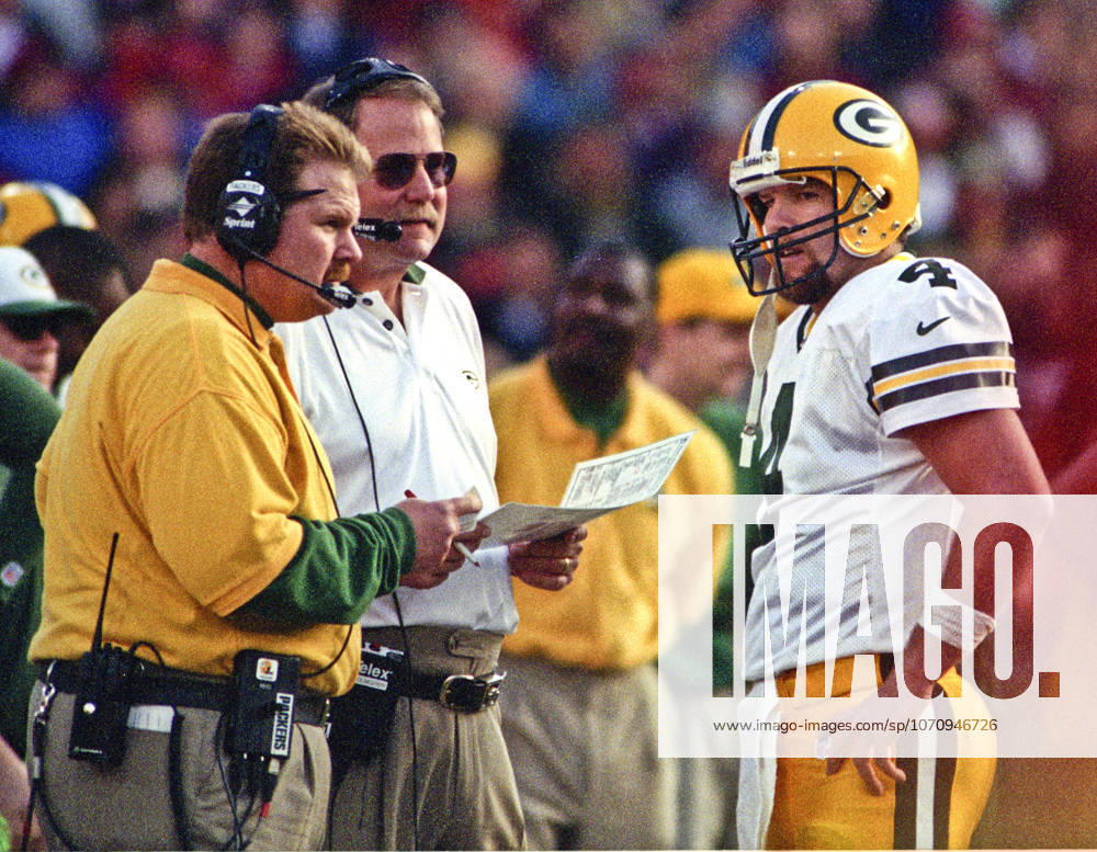 San Francisco, California, U.S - San Francisco 49ers vs. Green Bay Packers Candlestick Park Sunday, January 3, 1999. 49ers beat Packers 30-27. Green Bay Packers quarterback Brett Favre (4) talks with head coach Mike Holmgren.