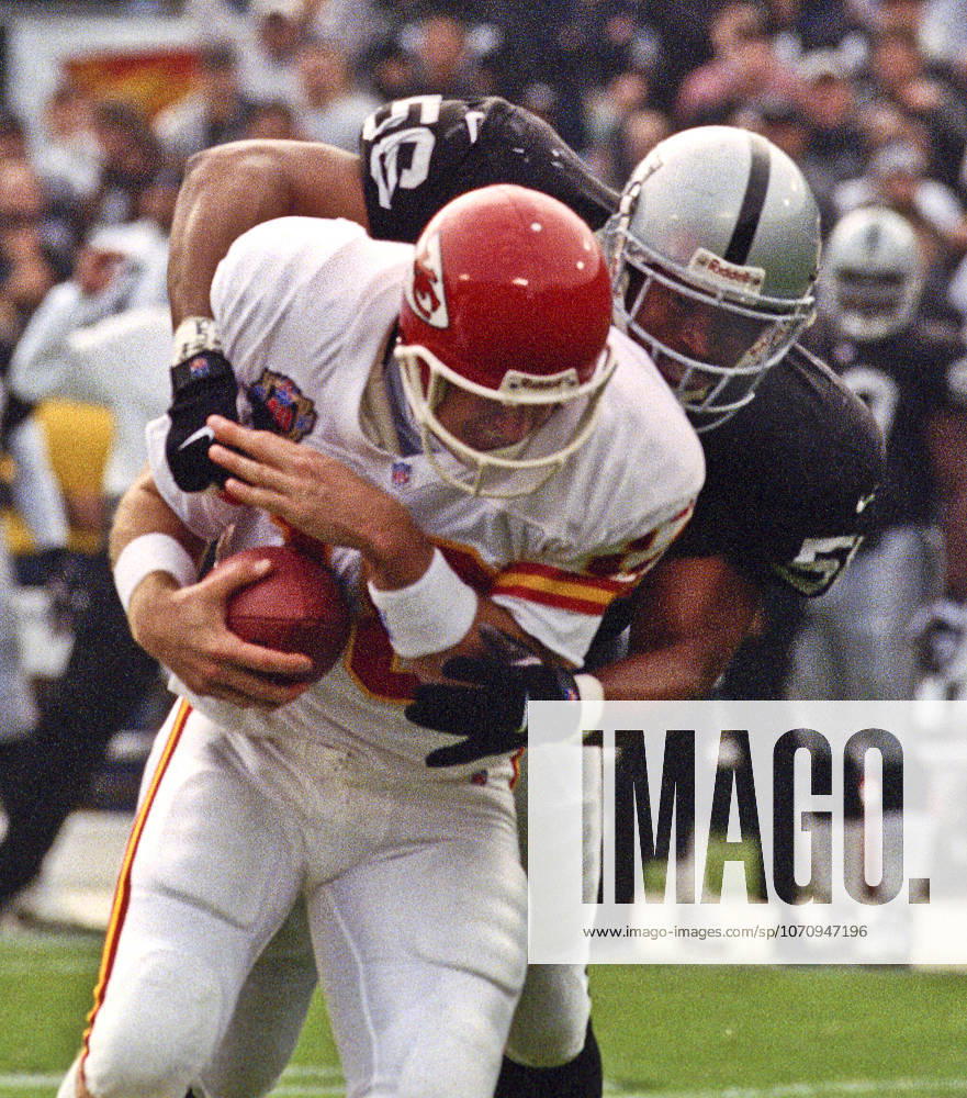 Oakland, California, U.S - Oakland Raiders vs. Kansas City Chiefs at Oakland Alameda County Coliseum Sunday, November 29, 1999. Chiefs beat Raiders 37-34. Oakland Raiders linebacker Sam Sword (56) sacks Kansas City Chiefs quarterback Elvis Grbac