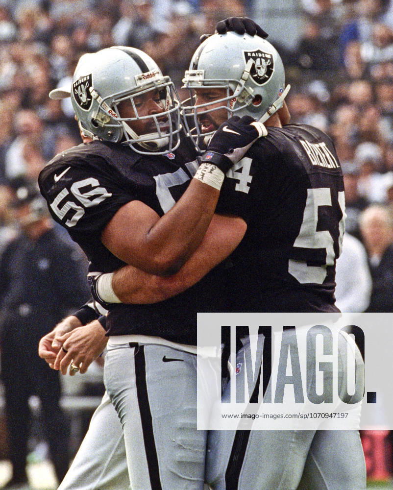 Oakland, California, U.S - Oakland Raiders vs. Kansas City Chiefs at Oakland Alameda County Coliseum Sunday, November 29, 1999. Chiefs beat Raiders 37-34. Oakland Raiders linebacker Sam Sword (56) and linebacker Greg Biekert