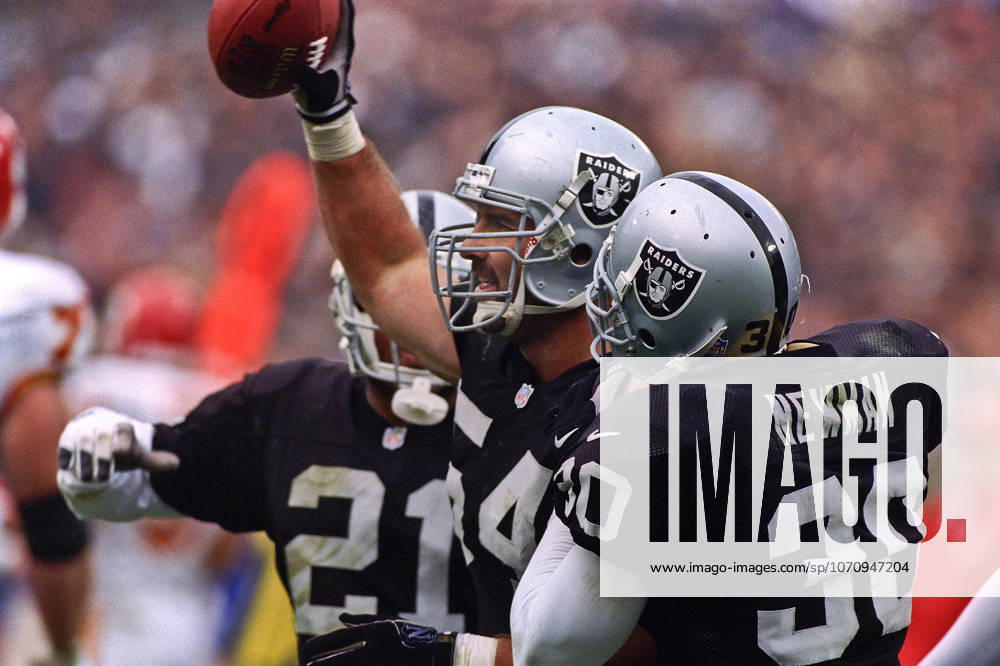 Oakland, California, U.S - Oakland Raiders vs. Kansas City Chiefs at Oakland Alameda County Coliseum Sunday, November 29, 1999. Chiefs beat Raiders 37-34. Oakland Raiders linebacker Greg Biekert (54) recovers ball.