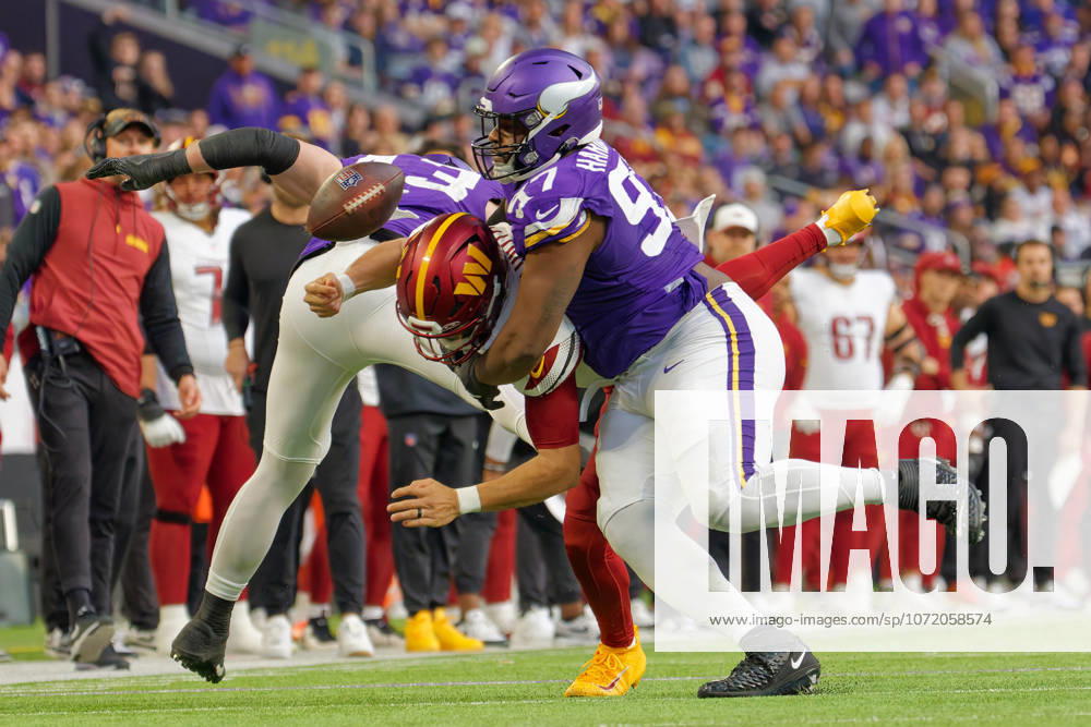 NFL, American Football Herren, USA Washington Commanders at Minnesota Vikings Minnesota Vikings Nose Tackle Javon Hargrave (97) tackled Washington Commanders Quarterback Jayden Daniels (5) and forces fumble during the NFL regular season game at US Bank Stadium in Minneapolis Minnesota on December 7, 2025. The Minnesota Vikings defeated the Washington Commanders 31-0 (Jeff Scudder Image of Minneapolis Minnesota United States