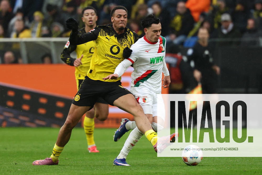 Dortmund, Germany, 14.03.26, Felix Nmecha (Borussia Dortmund) und Fabian Rieder (FC Augsburg) im Zweikampf während des Spiels der 1. Bundesliga zwischen Borussia Dortmund - FC Augsburg im Signal Iduna Park in Dortmund. (Photo by Joachim Bywaletz) DFB DFL REGULATIONS PROHIBIT ANY USE OF PHOTOGRAPHS AS IMAGE SEQUENCES AND OR QUASI-VIDEO.