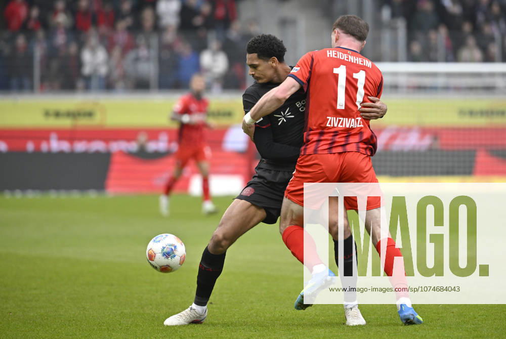 Zweikampf, Aktion Budu Zivzivadze Siwsiwadse 1. FC Heidenheim 1846 FCH (11) gegen Jarell Quansah Bayer 04 Leverkusen (04) 1. FC Heidenheim 1846 FCH vs Bayer 04 Leverkusen B04 21.03.2026 DFL REGULATIONS PROHIBIT ANY USE OF PHOTOGRAPHS AS IMAGE SEQUENCES AND OR QUASI-VIDEO 1. FC Heidenheim 1846 FCH vs Bayer 04 Leverkusen