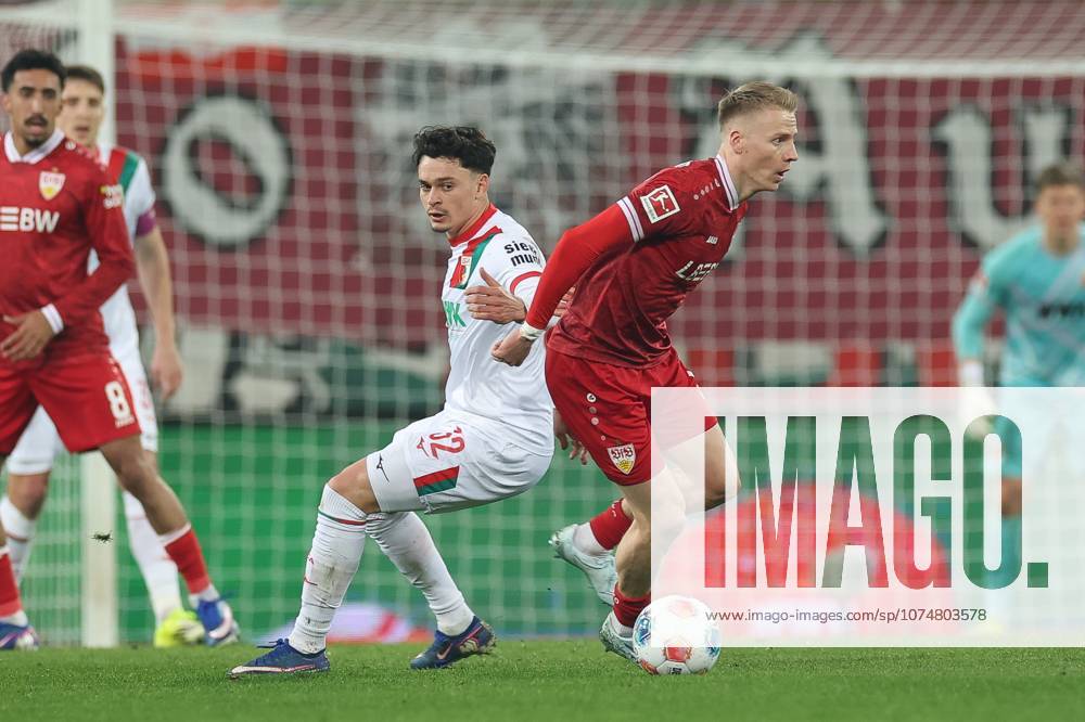 Im Zweikampf, Aktion, mit Fabian Rieder 32 (FC Augsburg), Chris Fuehrlich 10 (VfB Stuttgart), FC Augsburg vs. VfB Stuttgart, Fussball, 1. Bundesliga, 27. Spieltag, 22.03.2026 DFB regulations prohibit any use of photographs as image sequences and or quasi-video Augsburg Bayern Deutschland