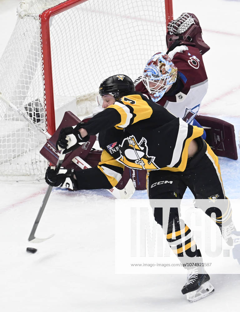 Pittsburgh Penguins right wing Rickard Rakell (67) attempts a backhanded shot on Colorado Avalanche goaltender Scott Wedgewood (41) during the second period at PPG Paints Arena in Pittsburgh on Tuesday, March 24, 2026. PIT2026032412 ARCHIExCARPENTER
