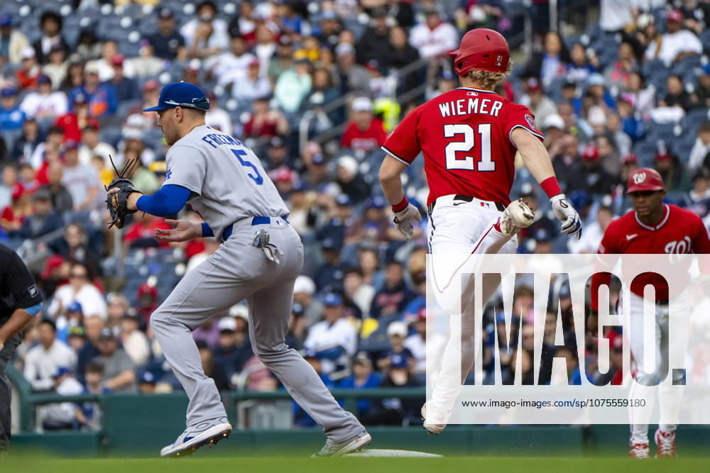 Los Angeles Dodgers first baseman Freddie Freeman (5) tags out Washington Nationals center fielder Joey Wiemer (21) at first base in the bottom of the fifth inning during a game at Nationals Park in Washington, DC on Sunday, April 5, 2026. WAP20260405340 BONNIExCASH