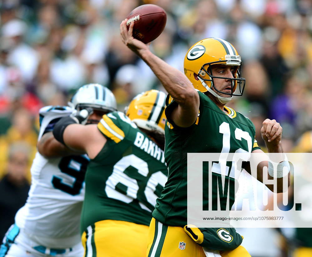 Oct. 19, 2014 - Green Bay, WI, USA - Green Bay Packers quarterback Aaron Rodgers (12) passes to a receiver during the first quarter on Sunday, Oct. 19, 2014, at Lambeau Field in Green Bay, Wis.