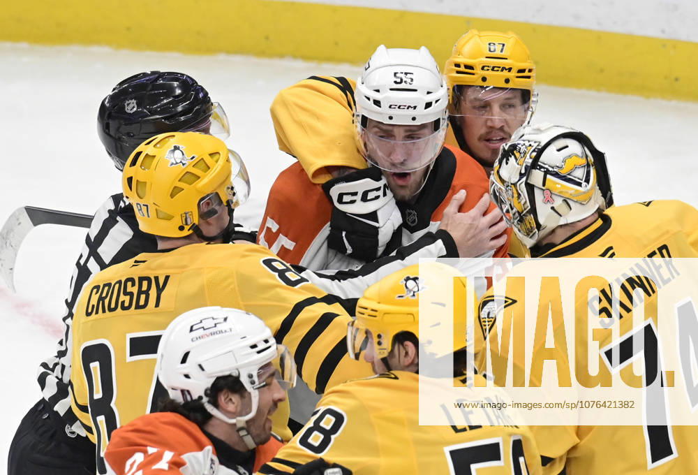 Pittsburgh Penguins right wing Rickard Rakell (67) holds back Philadelphia Flyers defenseman Rasmus Ristolainen (55) after fighting with Pittsburgh Penguins center Sidney Crosby (87) in the first period during game two in the opening round of the Eastern Conference playoffs between the Pittsburgh Penguins and Philadelphia Flyers at PPG Paints Arena in Pittsburgh on Monday, April 20, 2026. PIT2026042004 ARCHIExCARPENTER