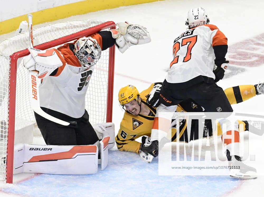 Pittsburgh Penguins right wing Rickard Rakell (67) falls to the ice as Pittsburgh Penguins defenseman Kris Letang shot finds the goal behind the skate of Philadelphia Flyers goaltender Dan Vladar (80) during the second period of the Pittsburgh Penguins 3-2 win in the opening round of the Eastern Conference playoffs at PPG Paints Arena in Pittsburgh on Monday, April 27, 2026. PIT2026042715 ARCHIExCARPENTER