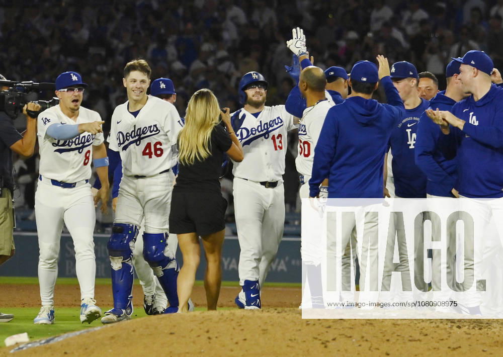 Los Angeles Dodgers Max Muncy (13) celebrates with teammates after hitting a walk-off RBI single in the tenth inning against the Kansas City Royals at Dodger Stadium in Los Angeles on Tuesday, August 11, 2026. LAP2026081102 JIMxRUYMEN