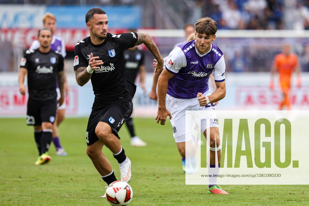 2026.08.15, Fußball, 2. Bundesliga, VfL Osnabrück - 1. FC Magdeburg, Stadion an der Bremer Brücke, 2.Spieltag, Saison 2026 2027: Falko Michel (1. FC Magdeburg 21) im Zweikampf gegen Bernd Riesselmann (VfL Osnabrueck 22) DFB regulations prohibit any use of photographs as image sequences and or quasi-video. Photo: WilkowskixPressefotoKochx Niedersachsen Deutschland