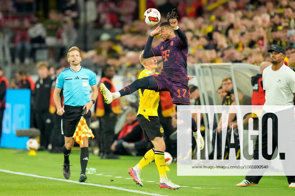 Daniel Svensson (Borussia Dortmund) und Michael Olise (FC Bayern Muenchen) battle for the ball during the Franz Beckenbauer Supercup match between Borussia Dortmund and FC Bayern Muenchen at Signal Iduna Park on August 22, 2026 in Dortmund, Germany. (Photo by Alex Gottschalk DeFodi Images) -