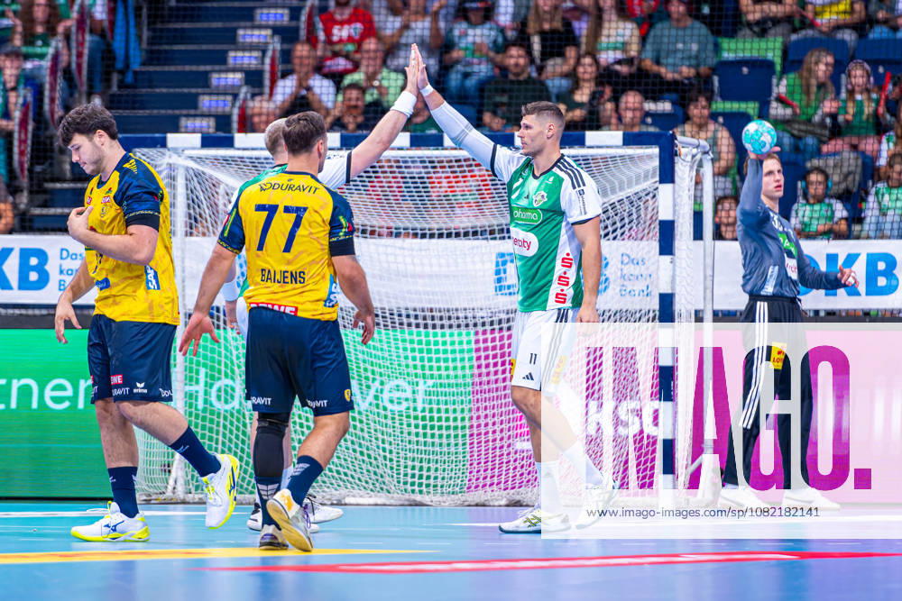 Sebastian Heymann (TSV Hannover-Burgdorf, Nr. 11) (v.l.), TSV Hannover-Burgdorf (grün) gegen Rhein-Neckar Löwen (gelb) am 1. Spieltag der Saison 2026 2027 in der Opel Handball-Bundesliga (30.08.2026, ZAG Arena (Hannover, GER),