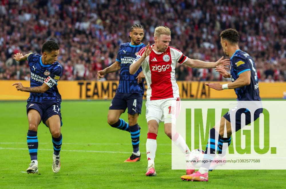 AMSTERDAM - AFC Ajax Amsterdam midfielder Davy Klaassen with PSV Eindhoven forward Ivan Perisic and PSV Eindhoven defender Mauro Junior during the Vriendenloterij Eredivisie match between Ajax and PSV at Johan Cruijff ArenA on 5 September 2026 in Amsterdam, Netherlands. PETER LOUS EYE4IMAGES DeFodi Images -