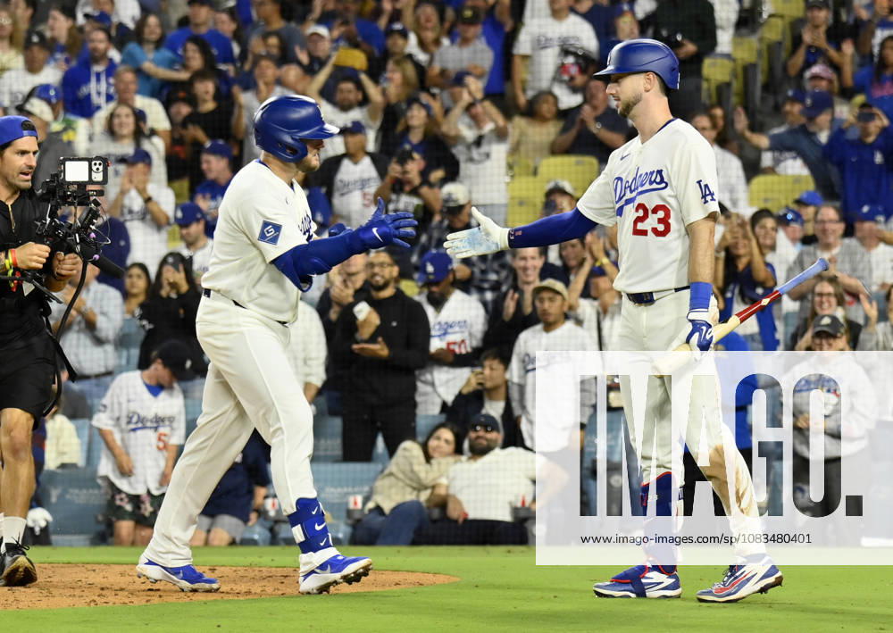 Los Angeles Dodgers Max Muncie celebrates with Kyle Tucker (23) after hitting a solo home run against the San Francisco Giants in a five-run eighth inning at Dodger Stadium in Los Angeles on Friday, September 18, 2026. The Dodgers defeated the Giants 8-2. LAP2026091803 JIMxRUYMEN