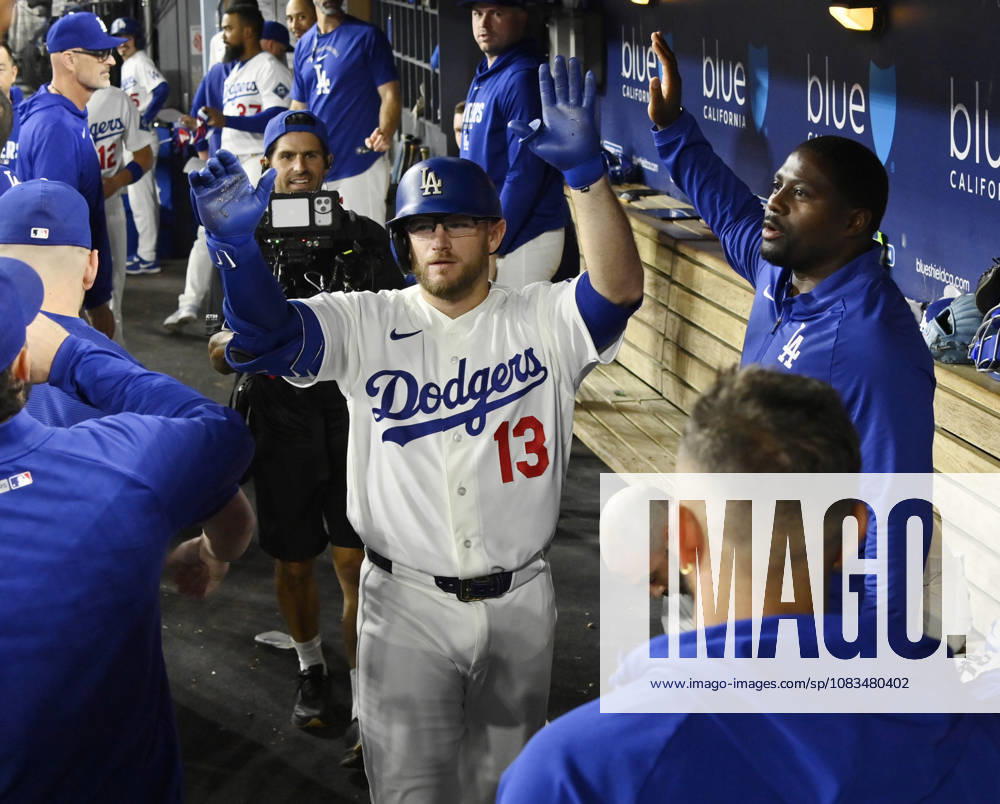 Los Angeles Dodgers Max Muncie celebrates with teammates in the dugout after hitting a solo home run against the San Francisco Giants in a five-run eighth inning at Dodger Stadium in Los Angeles on Friday, September 18, 2026. The Dodgers defeated the Giants 8-2. LAP2026091804 JIMxRUYMEN